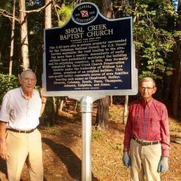 Brothers Joe and Houston Jones erecting a historical marker commissioned by the Alabama Historical Association.