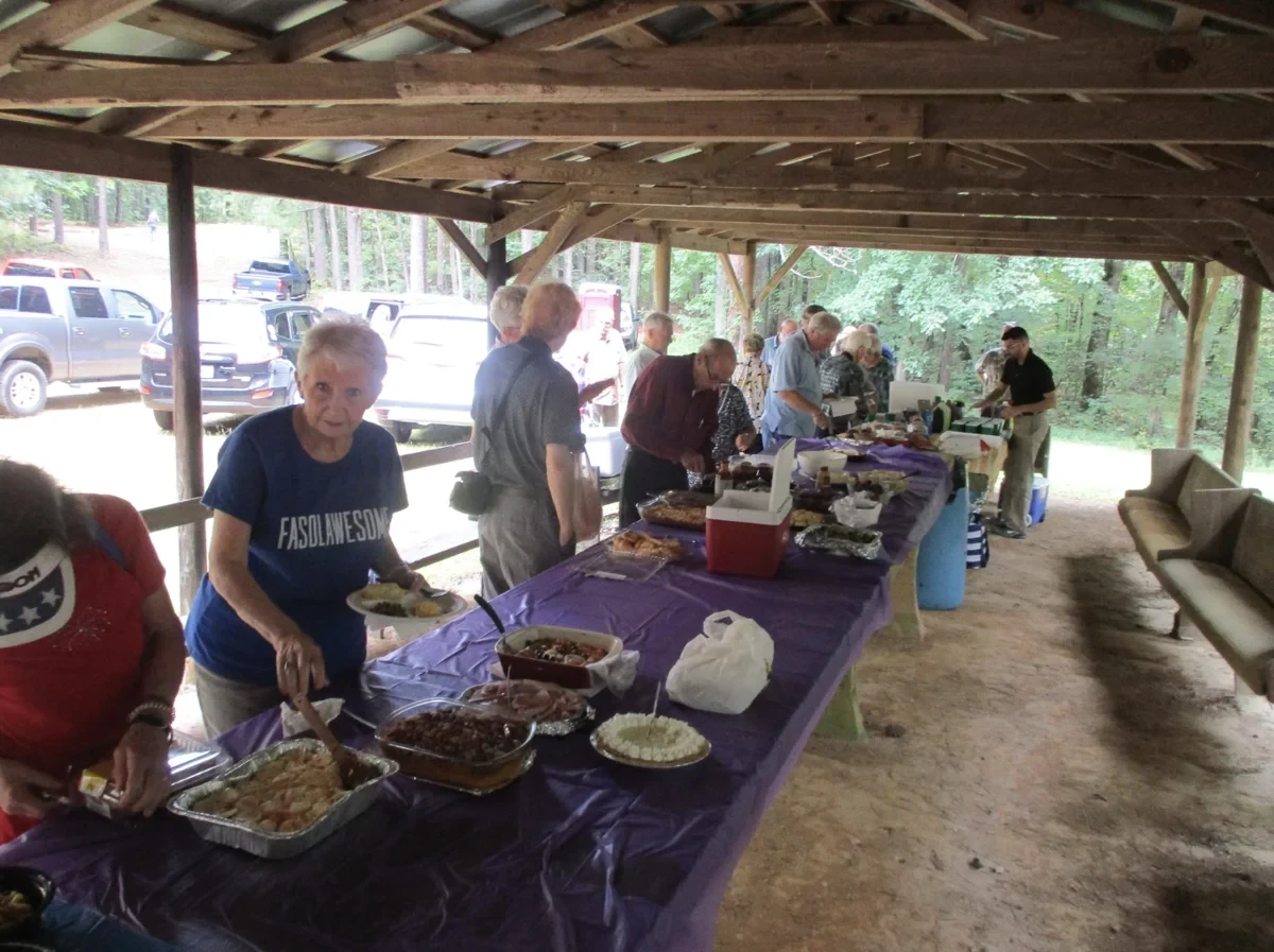 Dinner on the grounds during a recent singing. The Preservation Society replaced the dining shed roof within the past few years.