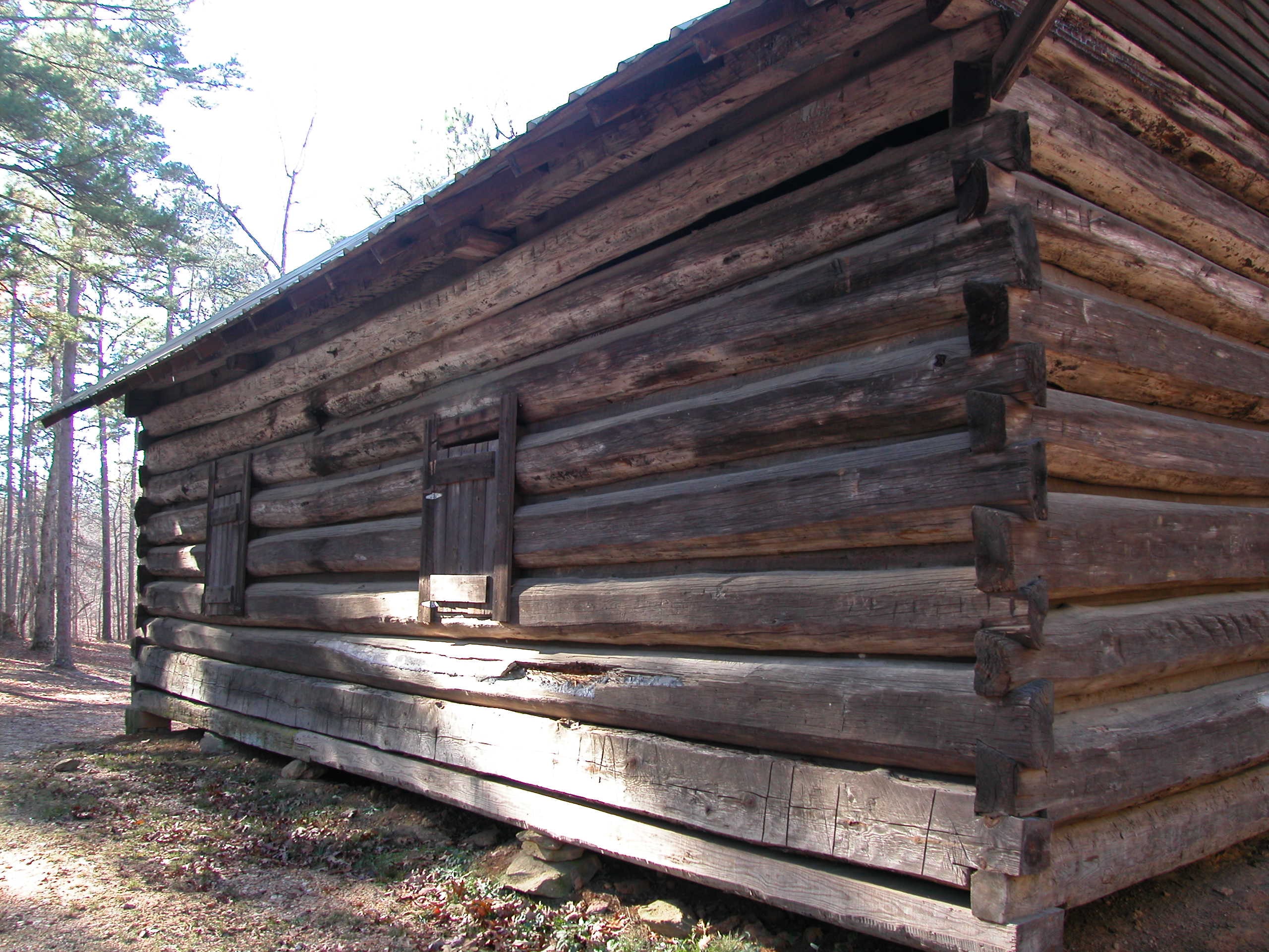 Close-up of the hand-hewn corner notching on the original log construction.